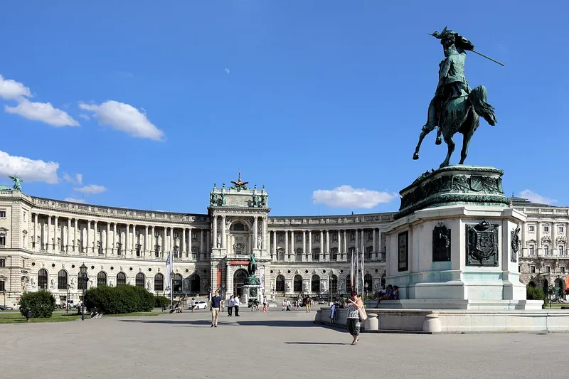 The curved Neue Burg facade in full width on a clear day